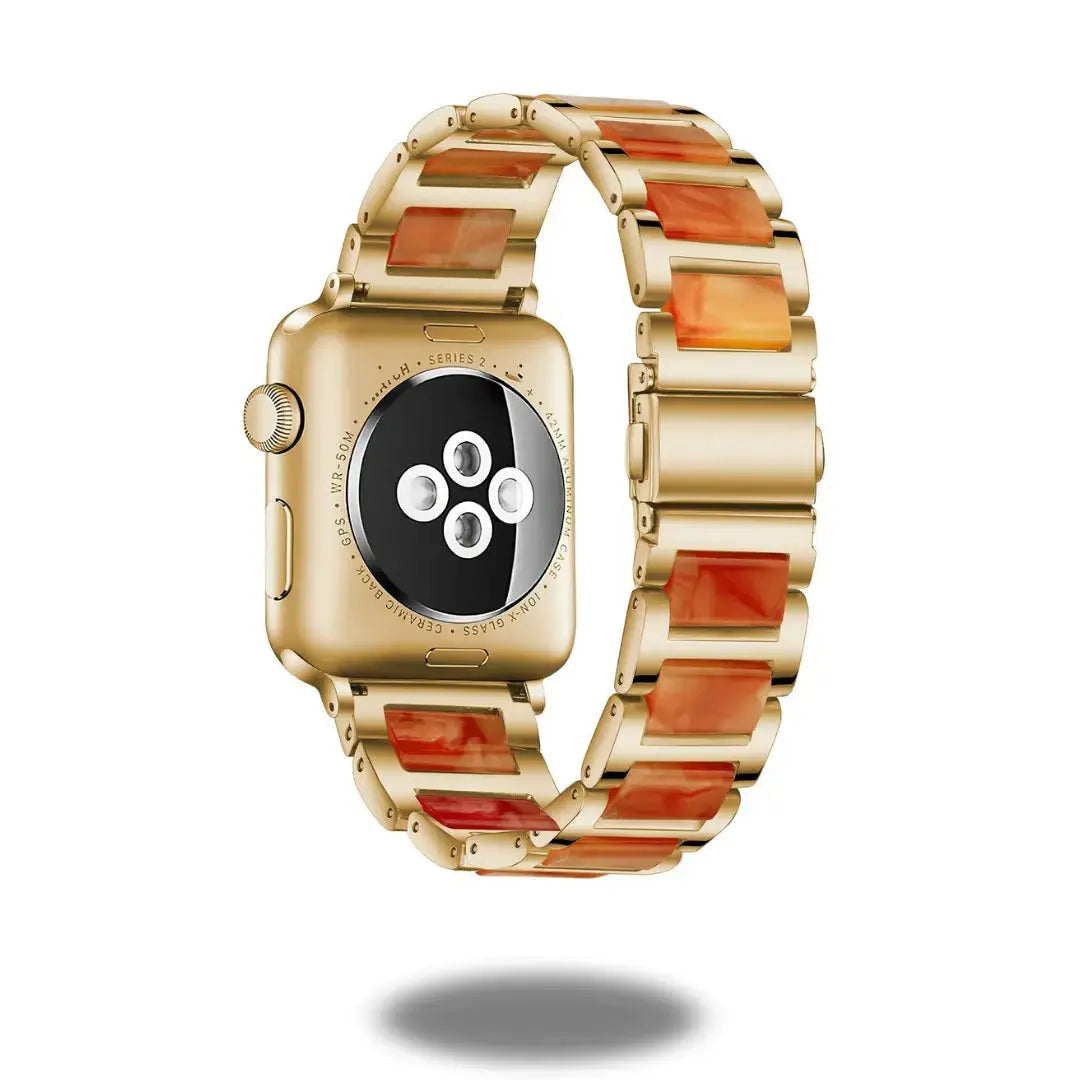 Luxury metal resin strap watch in gold with polished orange resin links, stylish, elegant, and comfortable for daily wear.