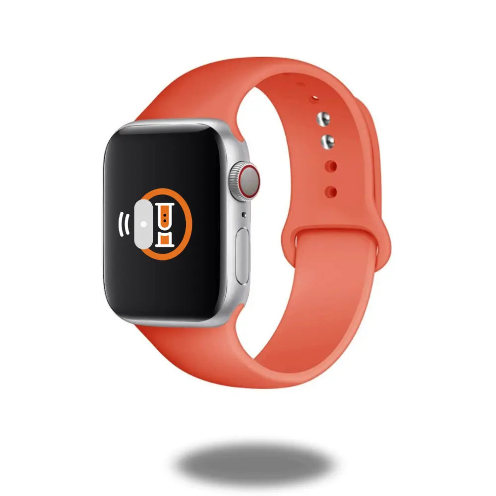 Apple Watch with an orange sports silicone band, showcasing modern design and functionality.