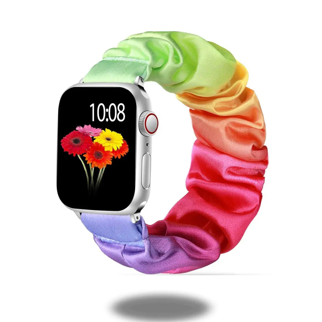 Colorful scrunchie band for Apple Watch featuring a rainbow design, perfect for daily wear and style.